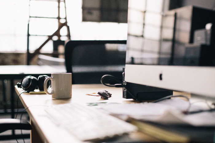 coffee mug on table, headphones